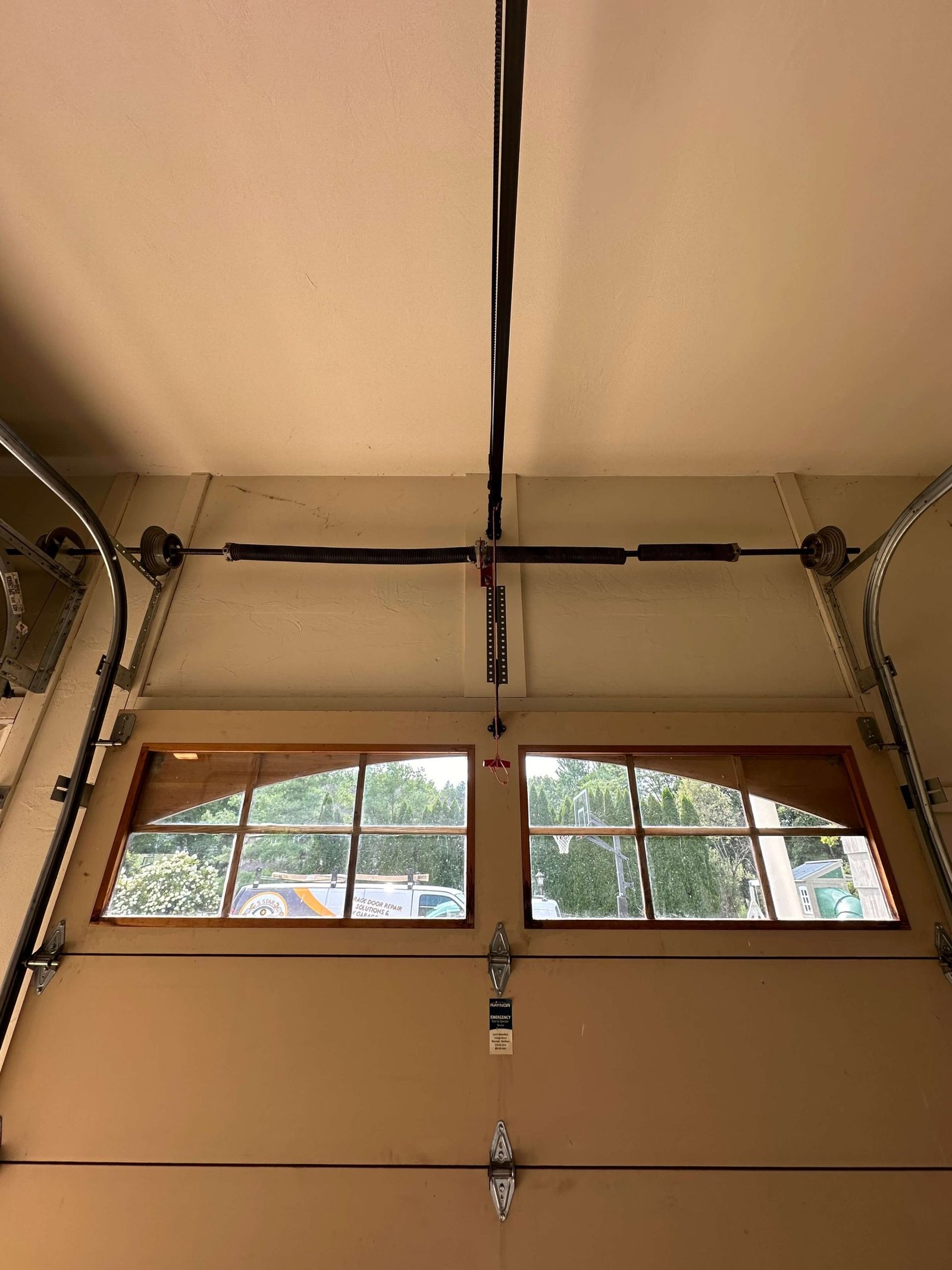 Inside view of a residential garage door before spring replacement in Woburn, MA.